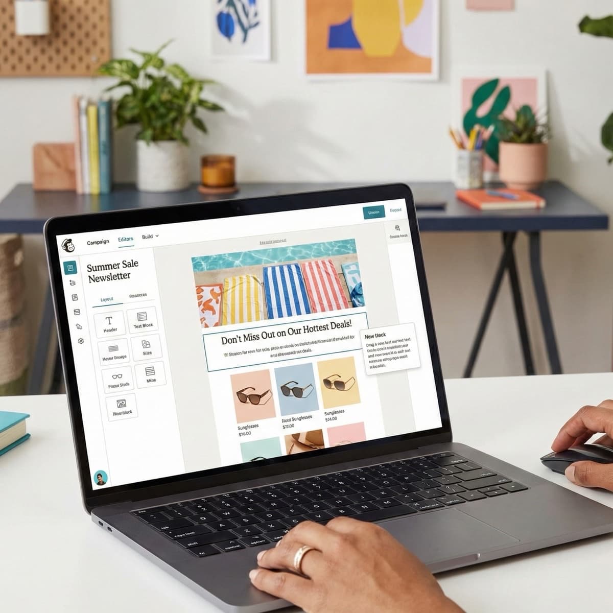 A laptop screen showing a work for Email Campaign Building in a home office