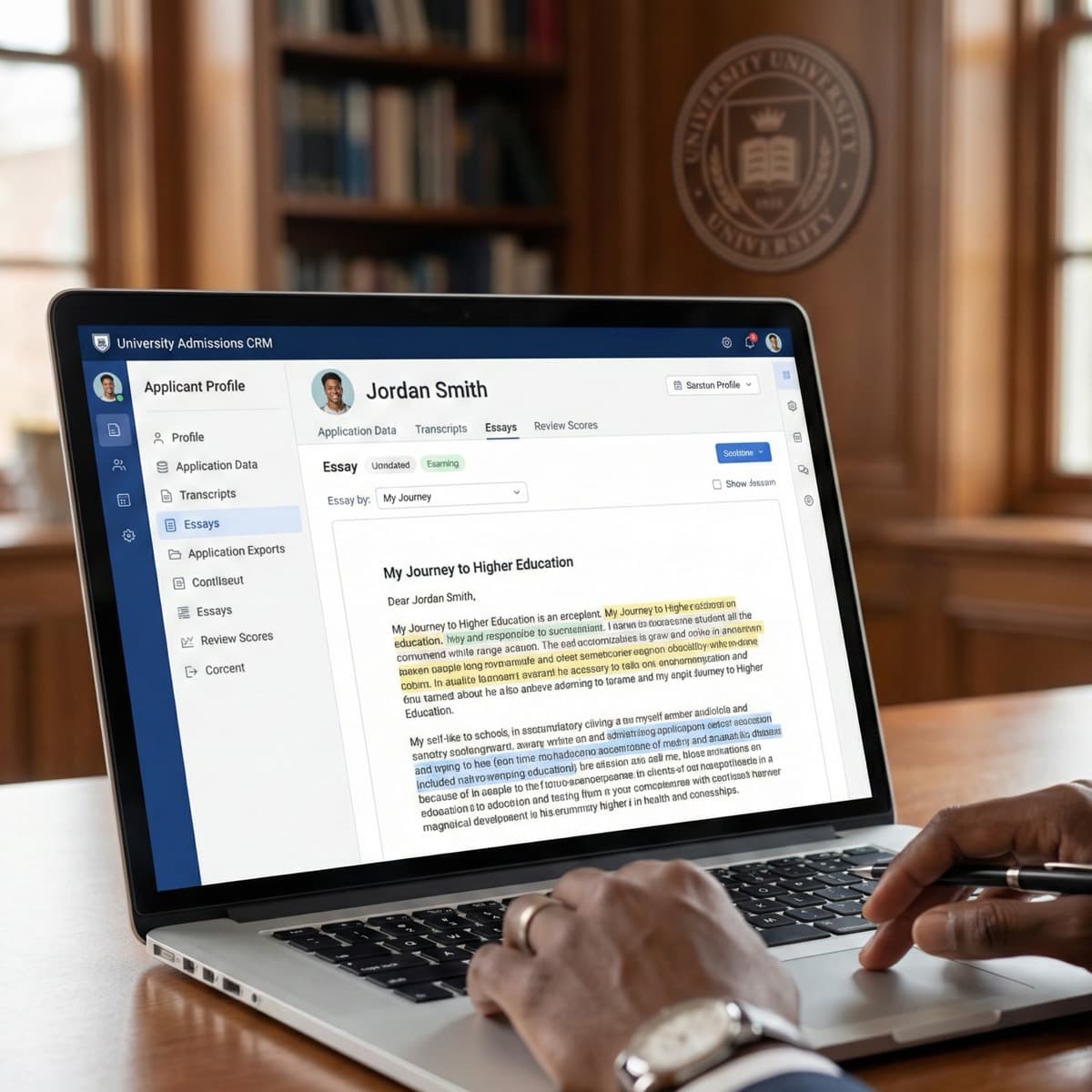 A laptop screen showing a work for Student Admissions Application Processing in a home office