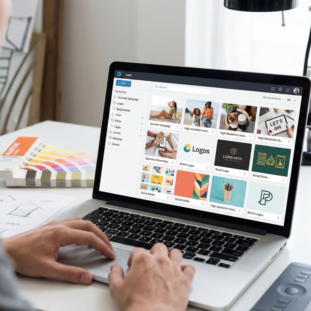 A laptop screen showing a work for Asset Management in a home office